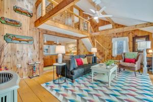a living room with a couch and a table at Your Trail's End in Maine in Wayne