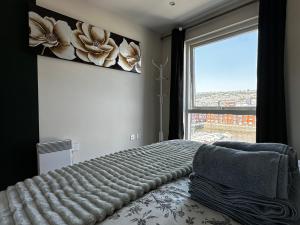 Voodi või voodid majutusasutuse Seaside APT with Harbour View toas