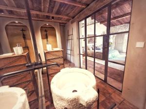 a bathroom with a toilet in a room at Moulin des Bergères in Mouriès +59 photos