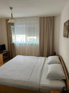 Ένα ή περισσότερα κρεβάτια σε δωμάτιο στο Guest House Olbina