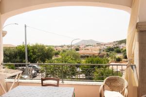 a balcony with a table and chairs and a view at Casa Cristallina in Posada