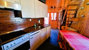 a kitchen with a sink and a counter top at La Granzeta - Chalet- Authentique - Evolene in Evolène