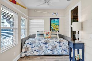 a bedroom with a bed and a window at Shady Mango home in Anna Maria