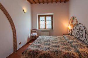 Postel nebo postele na pokoji v ubytování Agriturismo Casale trieste