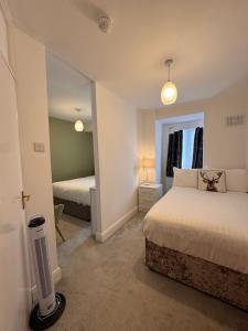 Ένα ή περισσότερα κρεβάτια σε δωμάτιο στο The Scala Hotel