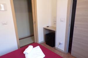 Postel nebo postele na pokoji v ubytování NUOVA AURORA Rent Rooms