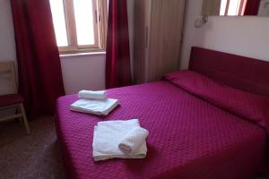 Postel nebo postele na pokoji v ubytování NUOVA AURORA Rent Rooms