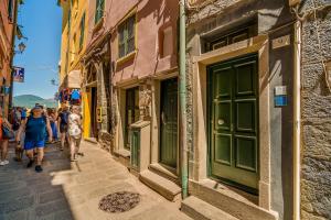 a group of people walking down a street at Vernazza Prestige 5TERRE 30 mt the sea AC in Vernazza