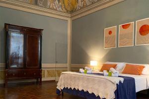 Postel nebo postele na pokoji v ubytování Albergo Diffuso Volterra