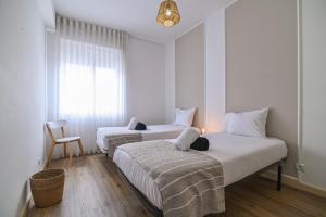 Postel nebo postele na pokoji v ubytování Cozy Apartment