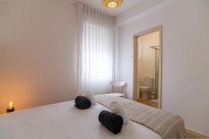 Postel nebo postele na pokoji v ubytování Cozy Apartment + 12 fotografií