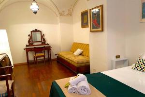 Postel nebo postele na pokoji v ubytování Albergo Diffuso Volterra