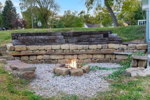 a fire pit in the middle of a yard at Branson Downtown Beauty - 4 BDR Home Sleeps 15 in Branson