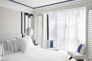 Postel nebo postele na pokoji v ubytování Hotel Mim Sotogrande Club Maritimo