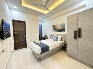 Ένα ή περισσότερα κρεβάτια σε δωμάτιο στο Axon Business Hotel Kondapur HITEC City Hyderabad +88 φωτογραφίες
