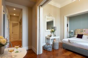 Posteľ alebo postele v izbe v ubytovaní Serristori Palace Residence