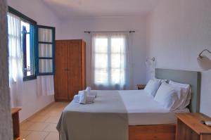 Ένα ή περισσότερα κρεβάτια σε δωμάτιο στο Agelos Studios
