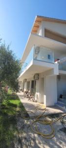 a building with a hose on the side of it at Vasiliki Apts in Vasiliki