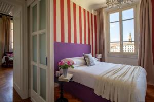 Posteľ alebo postele v izbe v ubytovaní Serristori Palace Residence + 22 fotografií