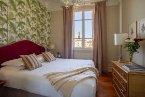 Posteľ alebo postele v izbe v ubytovaní Serristori Palace Residence