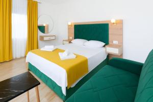 Postel nebo postele na pokoji v ubytování Apartmani Enydoo + 10 fotografií