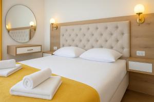 Postel nebo postele na pokoji v ubytování Apartmani Enydoo