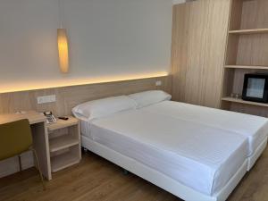 Postel nebo postele na pokoji v ubytování SH Campus Lyceum