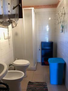 a bathroom with a shower and a toilet and a sink at Villetta sul Mare in Stintino +20 photos