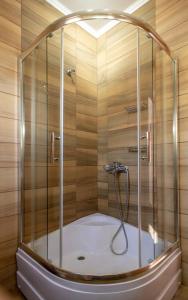 a shower with a glass enclosure in a bathroom at Sea Sun House, Aprovato Andros in Apróvaton