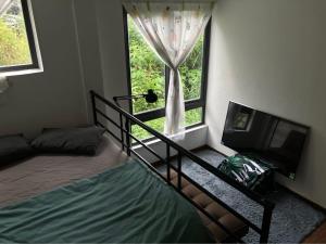 Postel nebo postele na pokoji v ubytování Hoshi DaLat House