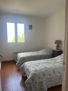 En eller flere senge i et værelse på Villa Poggiola