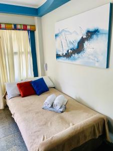 a bed in a room with two towels on it at Flat em natal beira mar in Natal