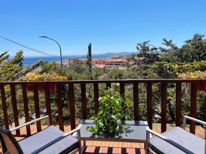 a balcony with a view of the ocean at Gassa d amante in Stintino