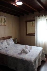 Łóżko lub łóżka w pokoju w obiekcie Casa Amadora