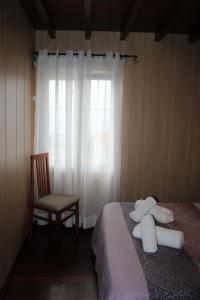 Łóżko lub łóżka w pokoju w obiekcie Casa Amadora