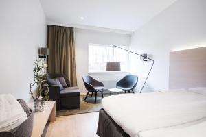 Ένα ή περισσότερα κρεβάτια σε δωμάτιο στο Best Western RC Hotel