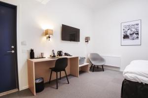 Ένα ή περισσότερα κρεβάτια σε δωμάτιο στο Best Western RC Hotel