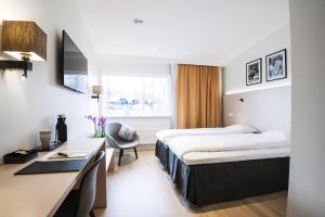 Ένα ή περισσότερα κρεβάτια σε δωμάτιο στο Best Western RC Hotel