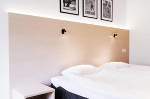 Ένα ή περισσότερα κρεβάτια σε δωμάτιο στο Best Western RC Hotel