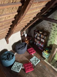 an overhead view of a living room with a attic at Chaumière du 16-ème siècles in Saint-Augustin