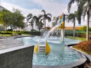 a water park at a resort with a water slide at Homestay at Trion KL in Kuala Lumpur