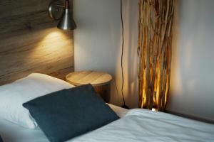 Postel nebo postele na pokoji v ubytování Hotel Juelsminde Strand