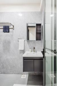 a bathroom with a sink and a shower at Luxury homes Kilimani in Nairobi