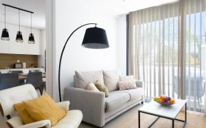 a living room with a white couch and a table at Cactus Apartment La Ribera in Santiago de la Ribera