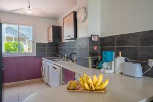 Kuchyň nebo kuchyňský kout v ubytování Appartement Côté Plage