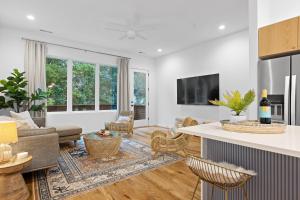 a living room with a couch and a table at Azul - An Atomic Ridge Home in Chattanooga