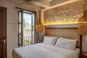 Postel nebo postele na pokoji v ubytování Hotel Casa Sonara