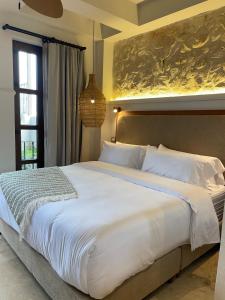 Postel nebo postele na pokoji v ubytování Hotel Casa Sonara
