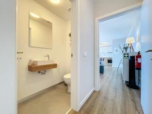a bathroom with a sink and a toilet at Atlantic Haven by Atlantic Holiday in Garajau +12 photos