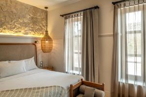 Postel nebo postele na pokoji v ubytování Hotel Casa Sonara